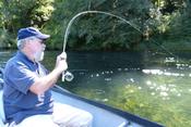 Vietnam veteran Leon hooks into a big one on one of Rivers of Recovery's fly-fishing programs. 
